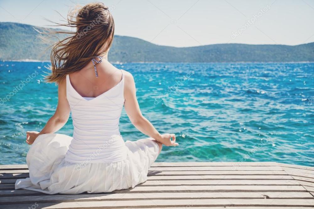 depositphotos_50878365-stock-photo-woman-meditating-at-the-sea