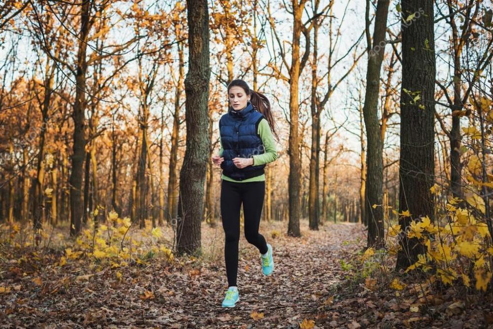 depositphotos_93214682-stock-photo-female-running-in-park-young