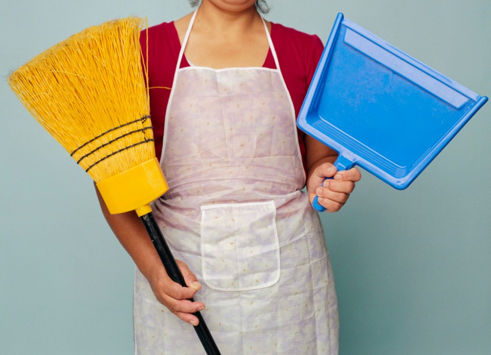 Woman Holding Broom and Dustpan