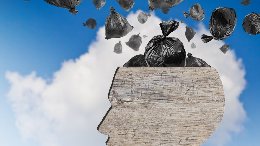 Head as wooden dustbin and falling garbage bags